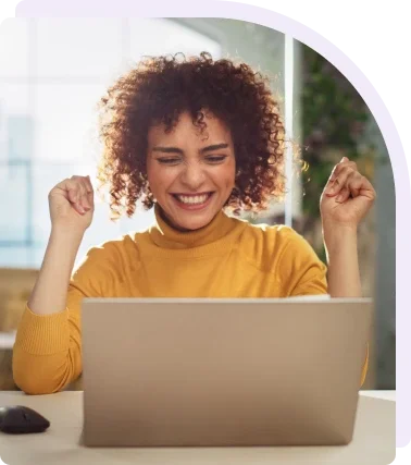 Happy Lady at a computer celebrating recognition